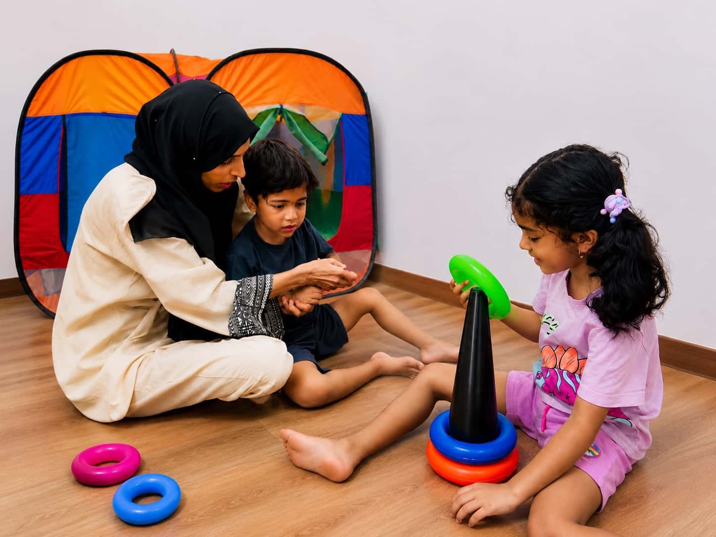 Therapist guiding children through a structured play activity at autism center in gujrat