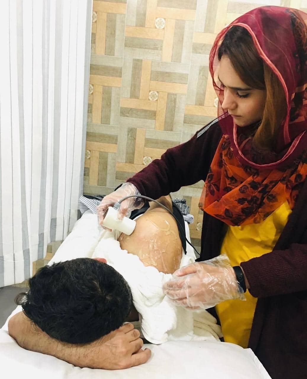 Dr. Rimsha Mubashar, PT treating her patient at Butt Autism & Rehab Center